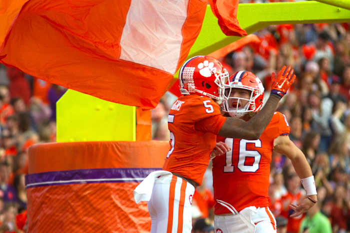 Nov 16, 2019; Clemson, SC, USA; Clemson Tigers wide receiver Tee Higgins (5) celebrates with quarterback Trevor Lawrence (16) after scoring a touchdown during the first half of the game against the Wake Forest Demon Deacons at Clemson Memorial Stadium. Mandatory Credit: Joshua S. Kelly-USA TODAY Sports